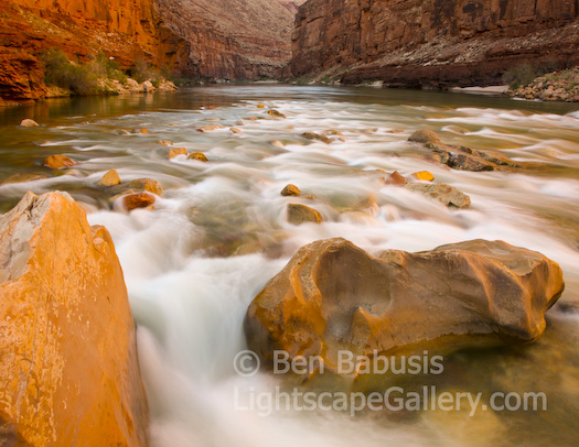 Golden Flow. Grand Canyon, Arizona. Water flows with a golden aura down the Grand Canyon at sunset.  Ben Babusis, Lightscape Gallery.