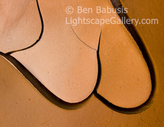 Mud Curves. Grand Canyon, Arizona. Rapid warming of clay-like mud at the bottom of a Grand Canyon tributary after a thunderstorm caused an array of beautiful patterns, such as this one, to emerge.  Ben Babusis, Lightscape Gallery.