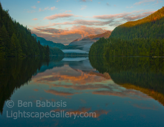 Sailboat Sunset. River's Inlet, British Columbia. The setting sun illuminates distant clouds over a remote inlet in western B.C.   Ben Babusis, Lightscape Gallery.