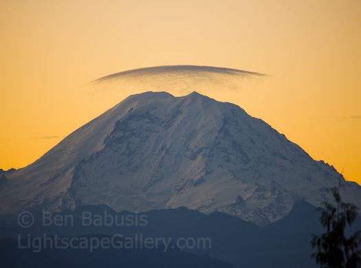Rainier's Halo. Issaquah, Washington. A wisp of cloud caps Mt. Rainier at sunset.  Ben Babusis, Lightscape Gallery.