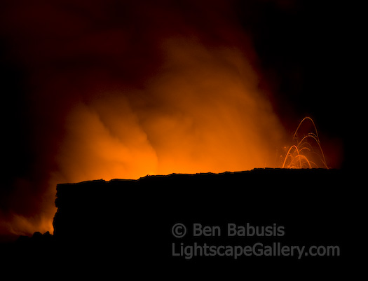 Sky on Fire. Kalapana, Hawaii. The night sky glows orange, and fiery red rocks are thrown into the air as the Kalapana lava flow enters the ocean.  Ben Babusis, Lightscape Gallery.