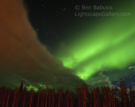 Dippin' into Green. Fairbanks, Alaska. The Big Dipper lies between a band of clouds and auroral band over Fairbanks.  Ben Babusis, Lightscape Gallery.