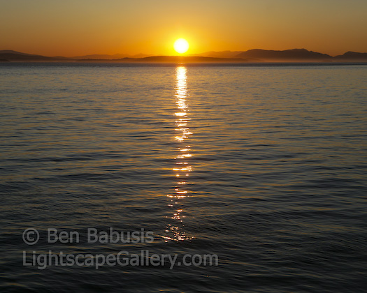 San Juan Sunset. San Juan Island, Washington. The sunset sets on a beautiful summer evening on San Juan Island.  Ben Babusis, Lightscape Gallery.