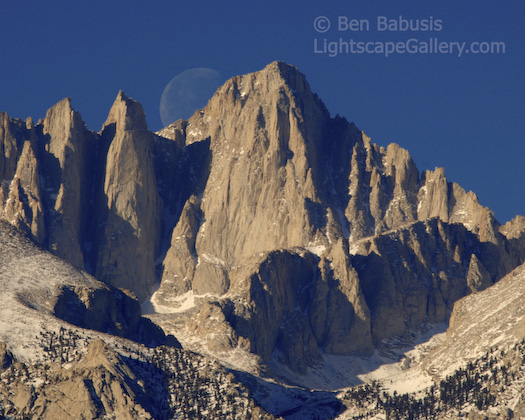 Moonset on Whitney. Mt. Whitney, California. The moon sets behind Mt. Whitney, the highest peak in the lower 49 states at 14,495 feet.  Ben Babusis, Lightscape Gallery.