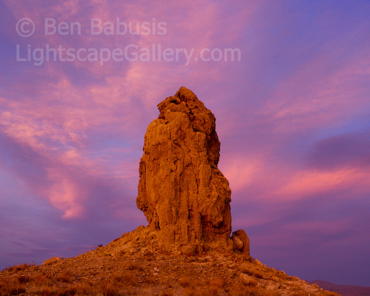 Trona Sunset. Trona, California. The sky lights up during sunset over Trona Towers. This region near the edge of the Mojave Desert is known for multiple unusual rock towers in an otherwise flat flatscape. They are thought to be formed from calcium carbonate deposits from spring water upwelling into a now dry lakebed, a formation known as fufa. Smaller and better known tufa towers can be seen on the shores of Mono Lake further north.  Ben Babusis, Lightscape Gallery.