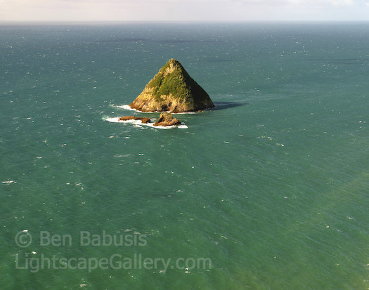 Lone Island. New Plymouth, New Zealand. A lone conical island rises from the sea off of New Plymouth on the North Island of New Zealand.  Ben Babusis, Lightscape Gallery.