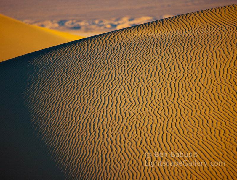 Corrugated Dune. Death Valley, CA. Early morning sunlight highlights the mesmerizing corrugated texture of wind scultped sand dunes in Death Valley.  Ben Babusis, Lightscape Gallery.