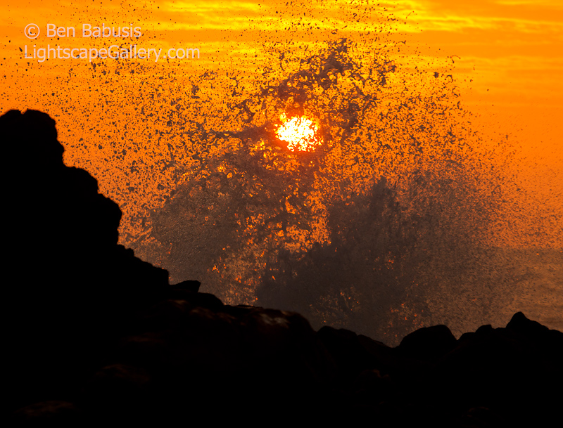 Splashing the Sun. Wailea, Maui. Crashing waves splash over the setting sun off the coast of Maui.  Ben Babusis, Lightscape Gallery.