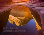 Red Reflections. North Coyete Buttes, Arizona. Dramatic red and yellow sandstone formations reflect in a puddle.  Ben Babusis, Lightscape Gallery.