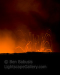 Firestorm. Kalapana, Hawaii. Fiery red rocks and bits of molten lava are thrown into the air as the Kalapana lava flow enters the ocean.  Ben Babusis, Lightscape Gallery.