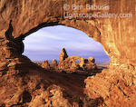 Turret Arch through North Window. Arches National Park, Utah. Morning's first light strikes Turret Arch as seen through the North Window.  Ben Babusis, Lightscape Gallery.