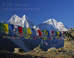 Rainbow of Prayers. Kumbu Valley, Nepal. Colorful prayer flags draped on a mountain top along the trail to Mt. Everest. � Ben Babusis, Lightscape Gallery.