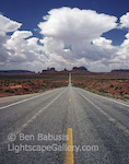 Endless Road. Monument Valley, Utah. A long stretch of straight pavement extends into Monument Valley on the border of Arizona and Utah.  Ben Babusis, Lightscape Gallery.