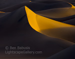 Dune Light. Death Valley, California. Dawn's early light casts deep and dark shadows across the Death Valley dunes, highlighting the curvy topography of the land.  Ben Babusis, Lightscape Gallery.