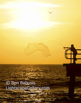 Fishnet. Key West, Florida. A youngster through out a fishing net at sunset.  Ben Babusis, Lightscape Gallery.