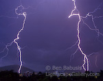 Twin Bolts. Salt Lake City, Utah. Twin lightning bolts strike Salt Lake city during a powerful summer thunderstorm.  Ben Babusis, Lightscape Gallery.