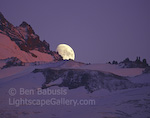 Rainier Moonrise. Mt. Rainier, Washington. The moon rises spectacularly over the southern flank of Mt. Rainier at sunset.  Ben Babusis, Lightscape Gallery.