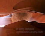 Tumbleweed Trap. Antelope Canyon, Arizona. A dry tumbleweed caught in the very narrow opening of a water carved slot canyon in the southwest.  Ben Babusis, Lightscape Gallery.