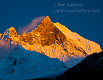 Heavenly Light. Machupuchare Base Camp, Nepal. The last rays of sunlight strike the summit of Machupuchare following a monsoon storm that brought 3 days of relentless heavy rain and snow.  Ben Babusis, Lightscape Gallery.