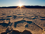 Saltrise. Badwater, Death Valley. Sun rises on a clear winter morning over Death Valley's Badwater Basin salt formations.  Ben Babusis, Lightscape Gallery.