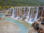 White River Waterfall. Lijiang, China. White glacial silt in the water makes it appear white.  Waterfalls are at the base of the Jade Dragon Snow Mountain near Lijiang.  Ben Babusis, Lightscape Gallery.